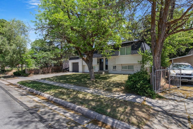8485 S 1575 E, Sandy, UT 84093 - tri-level home featuring a gate and driveway