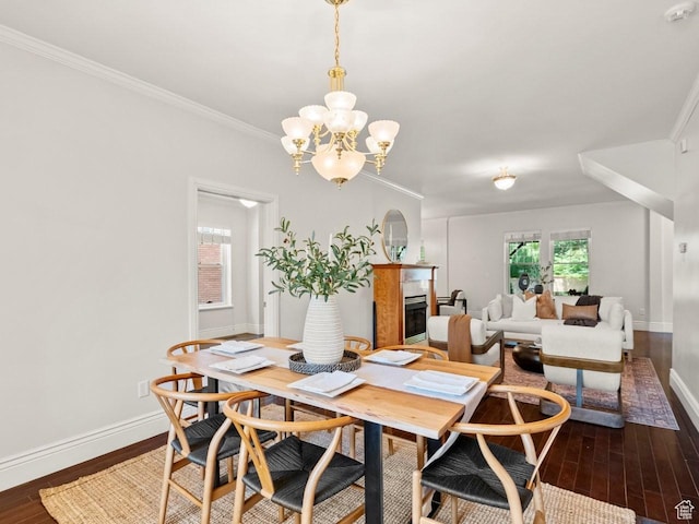 1146 E Harvard Ave S, Salt Lake City, UT 84105 - dining space featuring baseboards, dark wood finished floors, a fireplace, a chandelier, and ornamental molding