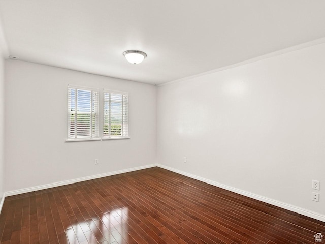 1146 E Harvard Ave S, Salt Lake City, UT 84105 - unfurnished room with baseboards and dark wood-style flooring