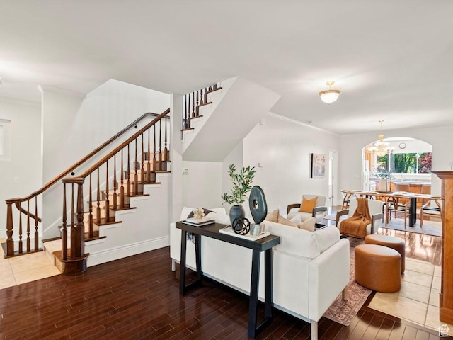 1146 E Harvard Ave S, Salt Lake City, UT 84105 - living room featuring wood finished floors, stairway, baseboards, ornamental molding, and a chandelier