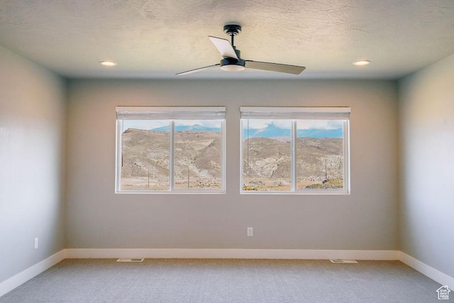 583 N Staci Dr, Hurricane, UT 84737 - empty room featuring light carpet, healthy amount of natural light, baseboards, a ceiling fan, and recessed lighting