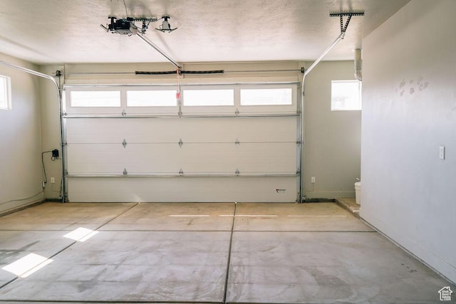 583 N Staci Dr, Hurricane, UT 84737 - garage featuring a garage door opener and baseboards
