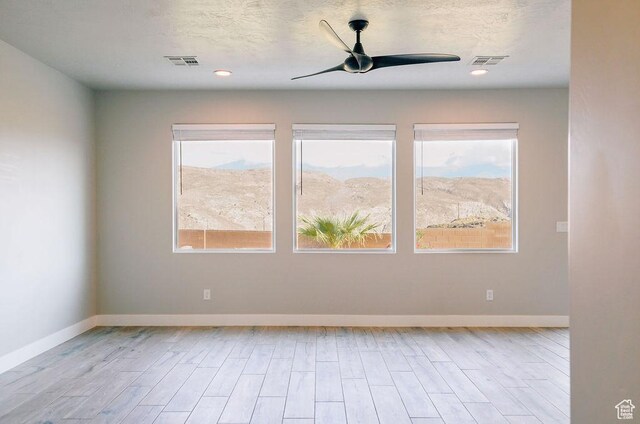 583 N Staci Dr, Hurricane, UT 84737 - spare room featuring healthy amount of natural light, a ceiling fan, wood finished floors, and recessed lighting