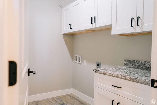 583 N Staci Dr, Hurricane, UT 84737 - washroom with washer hookup, light wood-type flooring, cabinet space, baseboards, and electric dryer hookup
