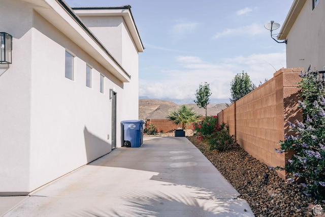 583 N Staci Dr, Hurricane, UT 84737 - view of property exterior with a fenced backyard, stucco siding, and a patio area