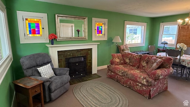 74 W Quayle Ave S, Salt Lake City, UT 84115 - carpeted living area with a chandelier and a tiled fireplace