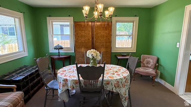 74 W Quayle Ave S, Salt Lake City, UT 84115 - carpeted dining space with a chandelier and baseboards