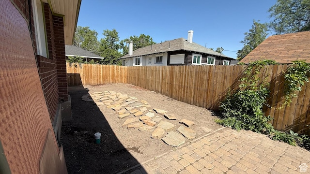 74 W Quayle Ave S, Salt Lake City, UT 84115 - fenced backyard with a patio area