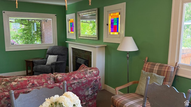 74 W Quayle Ave S, Salt Lake City, UT 84115 - carpeted living room with plenty of natural light and a tiled fireplace