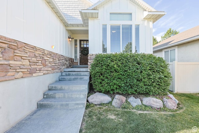 3946 W Birmingham Cir S, Jordan, UT 84009 - doorway to property featuring board and batten siding and stone siding