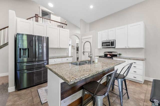 3946 W Birmingham Cir S, Jordan, UT 84009 - kitchen with stainless steel appliances, a sink, tasteful backsplash, baseboards, and white cabinetry