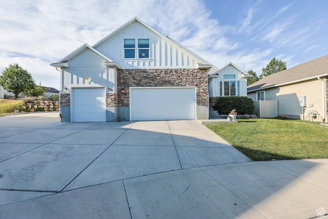 3946 W Birmingham Cir S, Jordan, UT 84009 - view of front of home with board and batten siding, stone siding, concrete driveway, and a garage