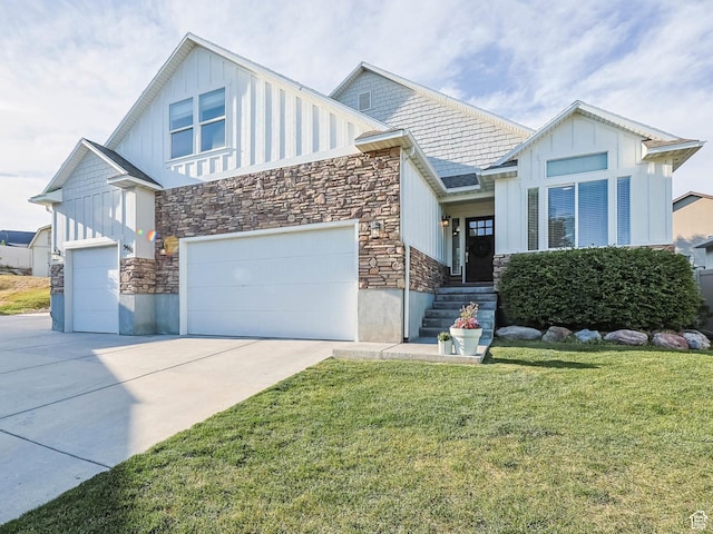 3946 W Birmingham Cir S, Jordan, UT 84009 - view of front of home featuring stone siding, board and batten siding, driveway, and a front lawn