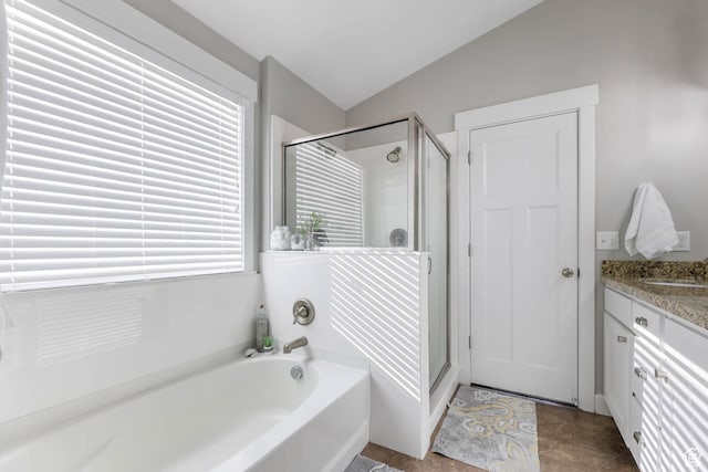 3946 W Birmingham Cir S, Jordan, UT 84009 - bathroom with vaulted ceiling, a shower stall, a bath, and vanity
