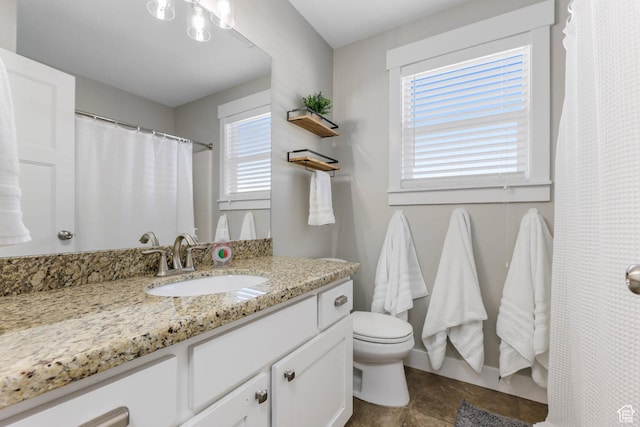 3946 W Birmingham Cir S, Jordan, UT 84009 - full bathroom featuring vanity, toilet, baseboards, a shower with curtain, and stone finish flooring