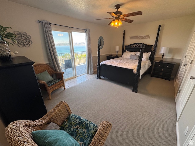 941 N Newberg Pl Unit 2, Garden City, UT 84028 - carpeted bedroom featuring access to exterior, a ceiling fan, and a textured ceiling