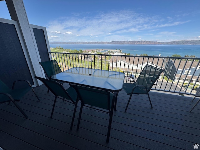 941 N Newberg Pl Unit 2, Garden City, UT 84028 - wooden terrace featuring a water and mountain view and outdoor dining area