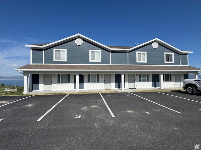 941 N Newberg Pl Unit 2, Garden City, UT 84028 - view of property with uncovered parking, covered porch, and a shingled roof