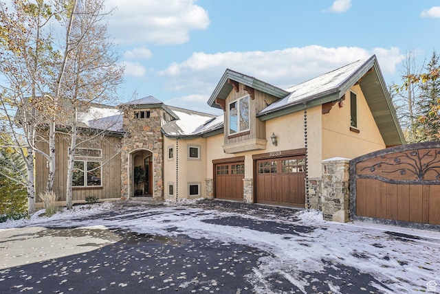 3239 Mountain Top Ln, Park City, UT 84060 - view of front of property featuring stone siding, driveway, a gate, and stucco siding