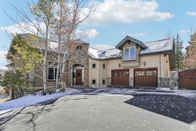3239 Mountain Top Ln, Park City, UT 84060 - view of front of house with stone siding, stucco siding, an attached garage, and asphalt driveway
