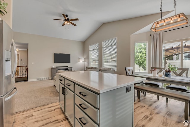 8831 W Digger Ln S, Magna, UT 84044 - kitchen featuring gray cabinets, stainless steel fridge with ice dispenser, lofted ceiling, light countertops, and ceiling fan