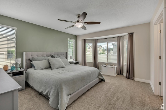 8831 W Digger Ln S, Magna, UT 84044 - bedroom featuring light colored carpet, ceiling fan, baseboards, and a textured ceiling