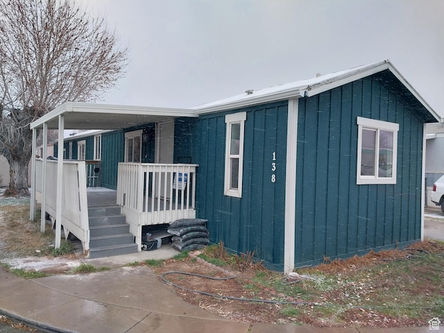 138 W 8865 S Unit 16, Sandy, UT 84070 - view of front of home featuring board and batten siding and covered porch