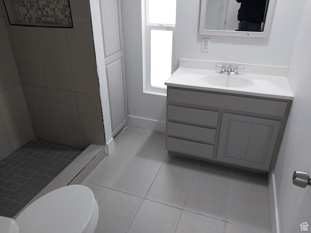 138 W 8865 S Unit 16, Sandy, UT 84070 - full bathroom featuring a shower stall, vanity, toilet, tile patterned flooring, and baseboards