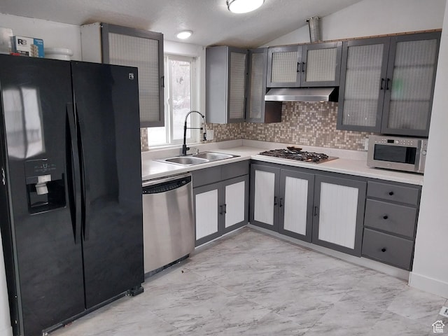 138 W 8865 S Unit 16, Sandy, UT 84070 - kitchen featuring stainless steel appliances, a sink, gray cabinets, under cabinet range hood, and lofted ceiling