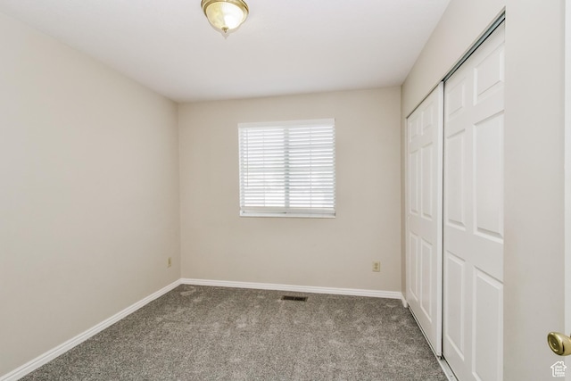 2802 W 4375 S, Roy, UT 84067 - unfurnished bedroom featuring carpet flooring, baseboards, and a closet