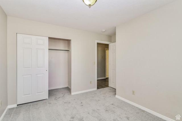 2802 W 4375 S, Roy, UT 84067 - unfurnished bedroom featuring carpet floors, baseboards, and a closet