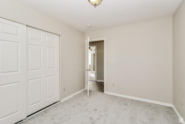 2802 W 4375 S, Roy, UT 84067 - unfurnished bedroom featuring light carpet, baseboards, and a closet