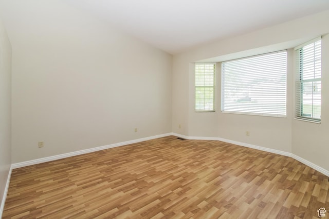 2802 W 4375 S, Roy, UT 84067 - spare room with light wood-style floors, healthy amount of natural light, and baseboards