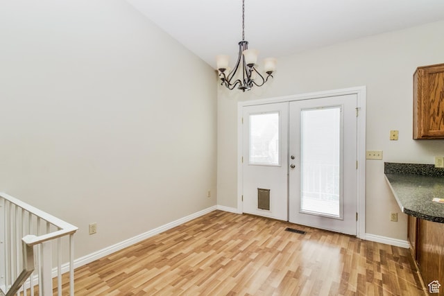 2802 W 4375 S, Roy, UT 84067 - foyer featuring light wood-type flooring, a chandelier, and baseboards