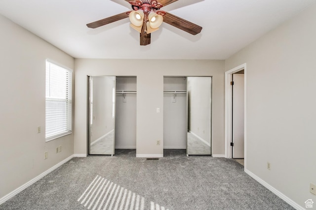 2802 W 4375 S, Roy, UT 84067 - unfurnished bedroom with multiple closets, carpet floors, a ceiling fan, and baseboards