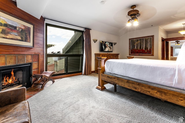 1485 Empire Ave Unit 511, Park City, UT 84060 - bedroom featuring a tile fireplace, access to outside, and a ceiling fan