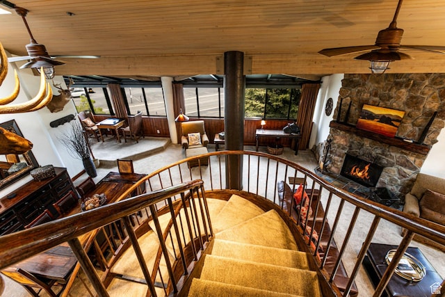 1485 Empire Ave Unit 511, Park City, UT 84060 - stairway featuring ceiling fan, wood ceiling, a stone fireplace, and carpet flooring
