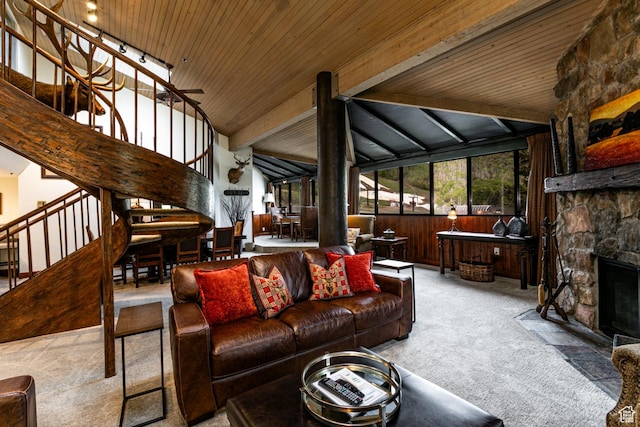 1485 Empire Ave Unit 511, Park City, UT 84060 - carpeted living area featuring stairs, wood ceiling with exposed beams, a stone fireplace, wood walls, and high vaulted ceiling