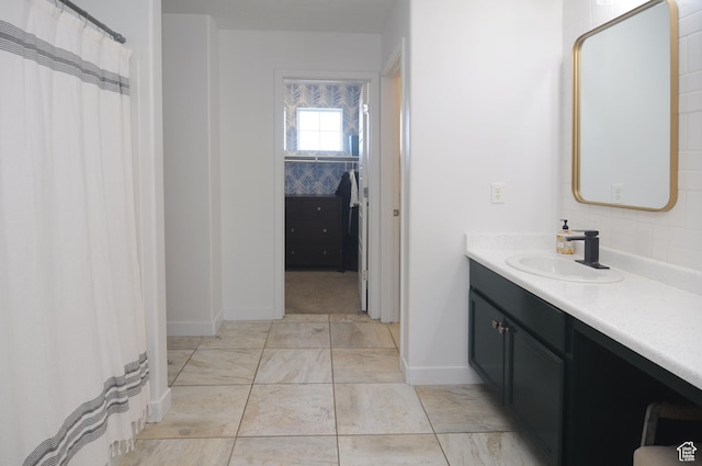 3639 S Clearwater Way, Syracuse, UT 84075 - bathroom with vanity, baseboards, and marble look tile flooring