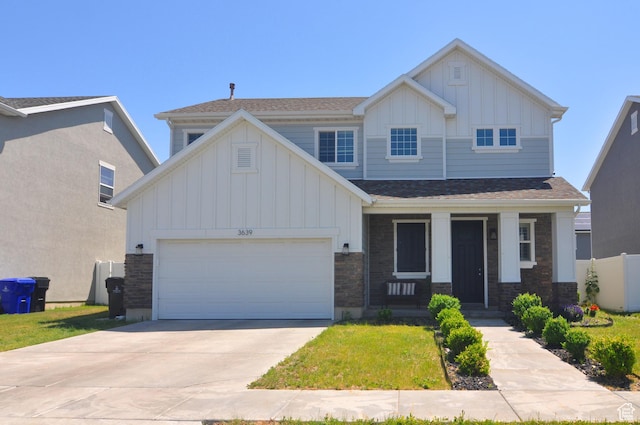 3639 S Clearwater Way, Syracuse, UT 84075 - craftsman house featuring board and batten siding, concrete driveway, an attached garage, a front yard, and covered porch