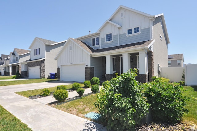 3639 S Clearwater Way, Syracuse, UT 84075 - craftsman-style house with board and batten siding, stone siding, concrete driveway, and a porch