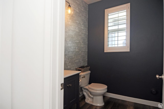 3639 S Clearwater Way, Syracuse, UT 84075 - half bathroom featuring toilet, wood finished floors, vanity, and baseboards