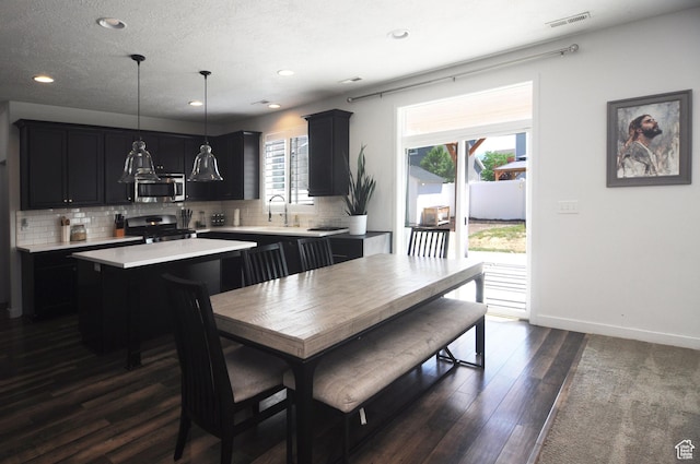 3639 S Clearwater Way, Syracuse, UT 84075 - dining area with dark wood-type flooring, recessed lighting, and baseboards