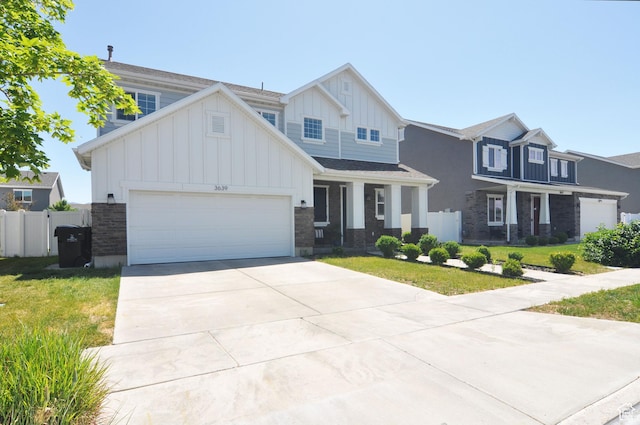 3639 S Clearwater Way, Syracuse, UT 84075 - view of front facade featuring board and batten siding, an attached garage, and driveway