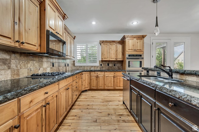 1498 W Mule Train Dr, Bluffdale, UT 84065 - kitchen with a sink, appliances with stainless steel finishes, light wood finished floors, dark stone counters, and recessed lighting