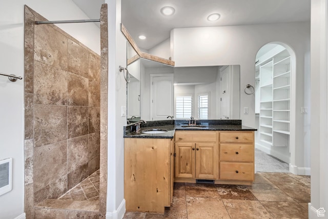 1498 W Mule Train Dr, Bluffdale, UT 84065 - bathroom with walk in shower, vanity, a walk in closet, baseboards, and recessed lighting