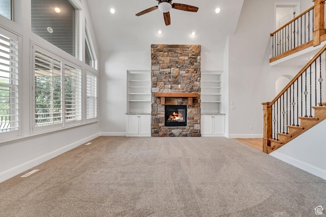 1498 W Mule Train Dr, Bluffdale, UT 84065 - unfurnished living room featuring carpet floors, a ceiling fan, plenty of natural light, a high ceiling, and recessed lighting