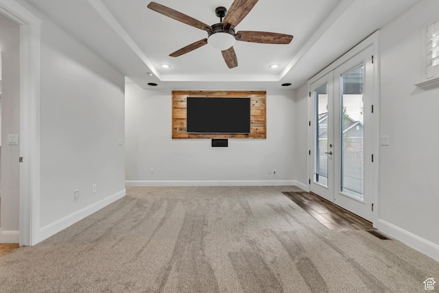 1498 W Mule Train Dr, Bluffdale, UT 84065 - unfurnished living room with carpet floors, a tray ceiling, ceiling fan, recessed lighting, and baseboards
