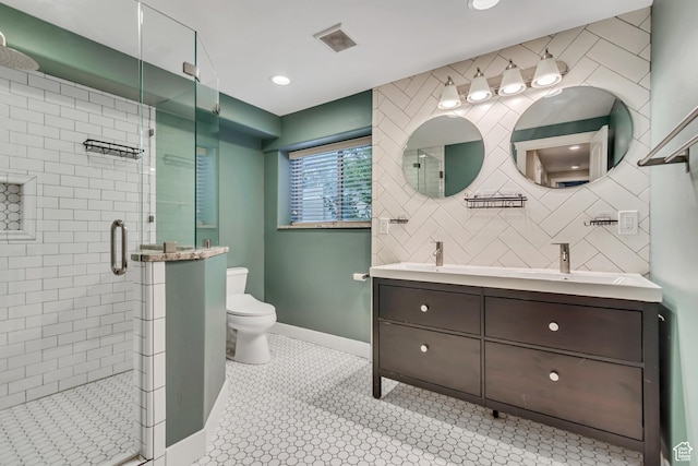 1498 W Mule Train Dr, Bluffdale, UT 84065 - bathroom featuring toilet, double vanity, a shower stall, baseboards, and tile patterned flooring