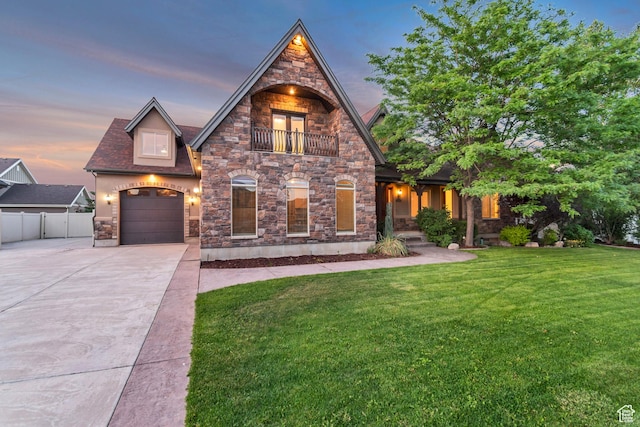 1498 W Mule Train Dr, Bluffdale, UT 84065 - view of front of property featuring a balcony, driveway, and stone siding